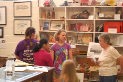 (from left) Deanna McKinney, Lynda Pedro and Naomi Cummings explore the Collinsville History Museum with Rebecca Clayton.